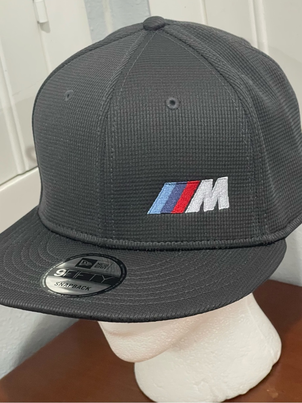 New Era Black Snapback Hat with Blue, Red & White BMW M Stripe